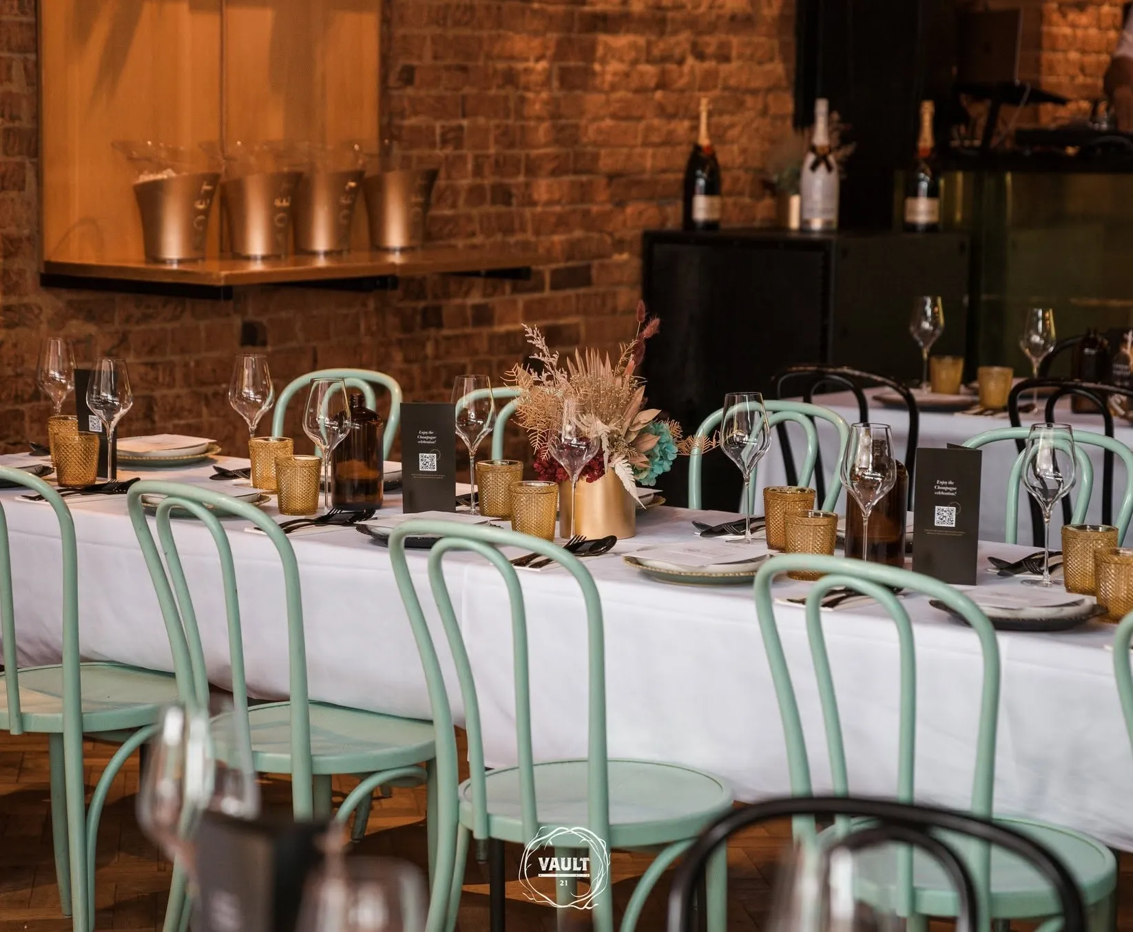 Champagne being poured at a table setting at Vault 21