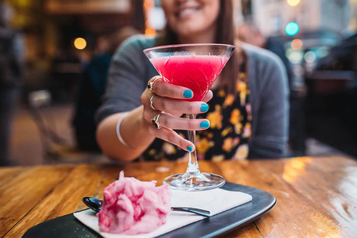 Lady holding a cocktail